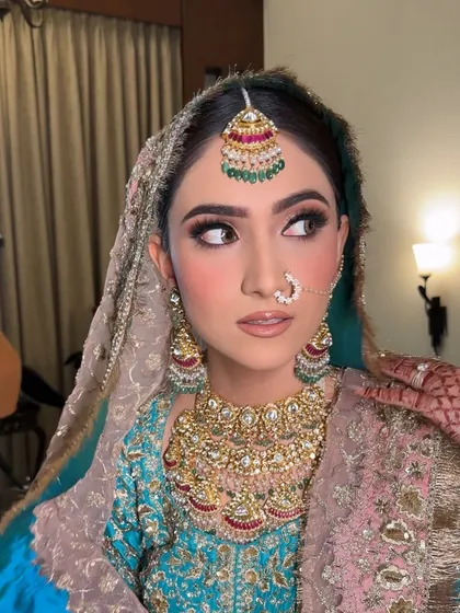 A side profile of the Anand Karaj glam look, showing the beautiful blush and contour that adds dimension to the face.