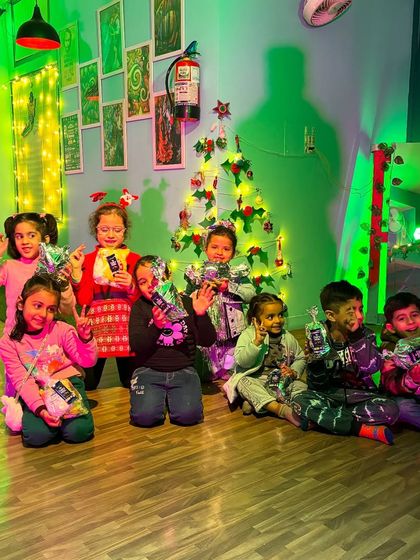 Waving and smiling for the camera. The holiday season brings extra joy and excitement to our classes.