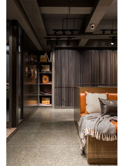 A quiet corner of the showroom, perfect for contemplation and discussion, with comfortable seating and a view of the various displays.