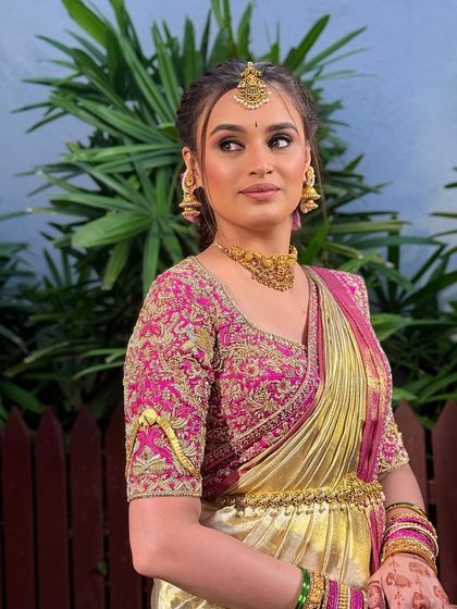 The complete engagement look. The modern hairstyle and soft makeup pair beautifully with her elegant saree.