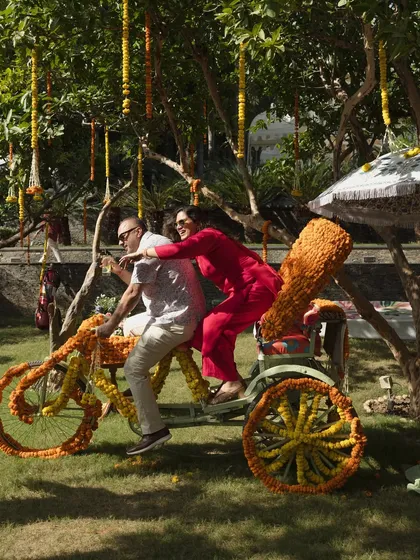 Adding playful elements like a flower-decorated rickshaw for guests to enjoy. It's these little details that make the guest experience memorable and fun.