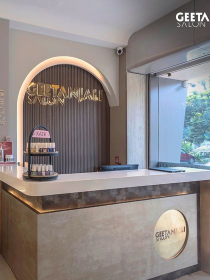 The elegant, curved reception desk at our Maple Tree, Ahmedabad salon, designed to welcome you in style.