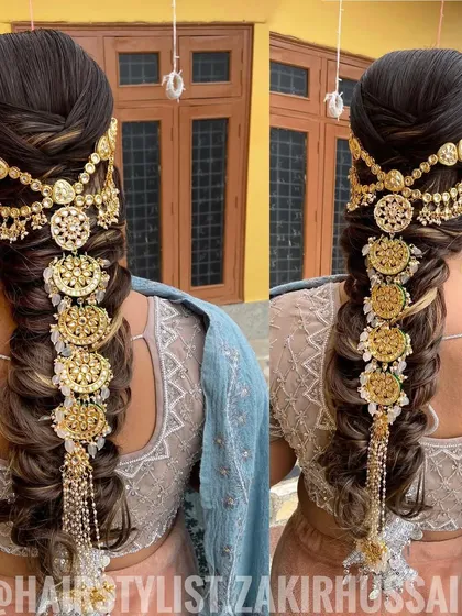 This is an example of a highly detailed and traditional bridal braid. I incorporated an elaborate gold 'jada' hair accessory that cascades down the length of the braid, creating a truly regal and unforgettable look for the wedding day.