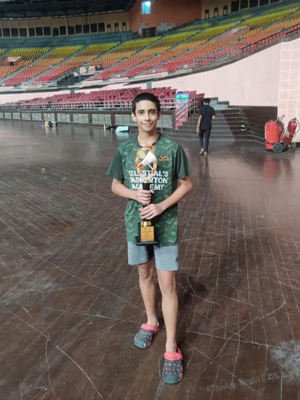 Our champion Siddhant Thakur holding his trophy after winning the Mixed Doubles U-15 title at the Delhi State Championship.