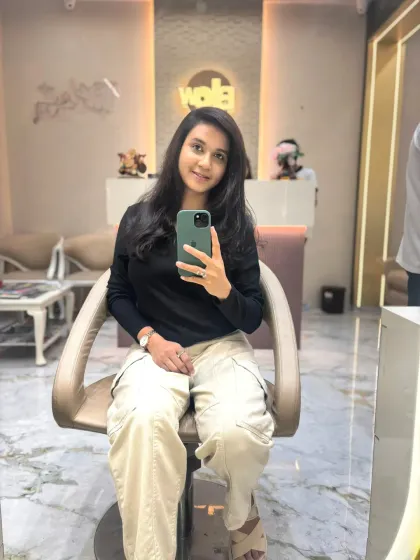 A mirror selfie from a happy client, showing off her new hair in our salon. We love seeing you capture your new look.