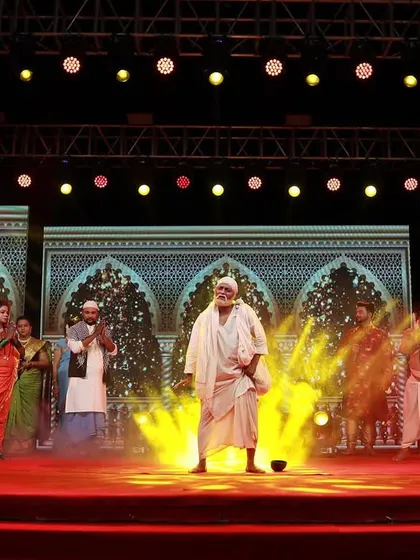 Here, I used a combination of spotlights and yellow-toned fog to create a dramatic and divine atmosphere for a performance. The background LED screens display intricate patterns to enhance the scene.