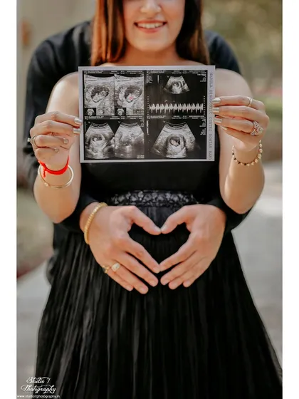 Bringing your sonogram pictures to the shoot is a wonderful way to personalize your photos. Here, we've made it the star of the show, a first glimpse of the love of your life.