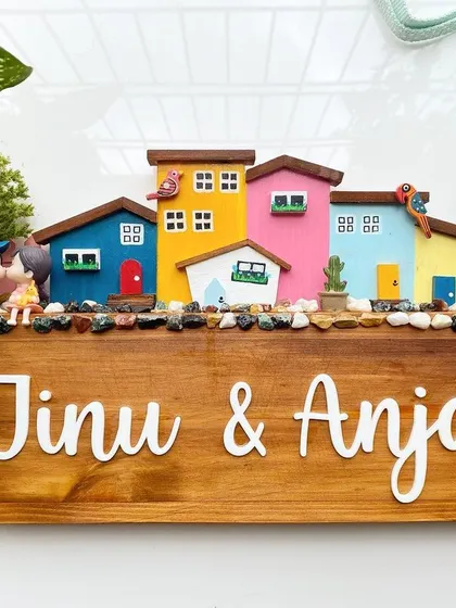 I love creating these vibrant cityscapes. This design features a row of colorful, hand-painted miniature houses on a stained wood base. It’s a playful and modern take on the family diorama, perfect for adding a splash of color to your entrance.