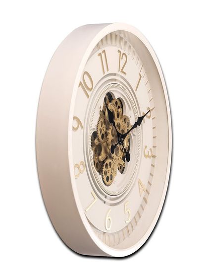 A side view of the Lunar Echo clock, showing its sturdy steel body and the depth of the moving gears. This is a high-quality piece designed to last.