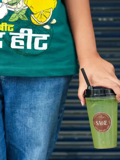 A lifestyle shot of a person holding a drink. This style of photography feels more personal and relatable, making it great for a brand's social media feed.