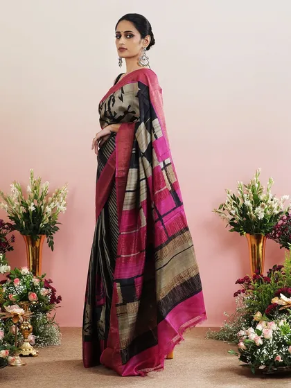 A side view that captures the interesting play of different patterns on this unique saree.