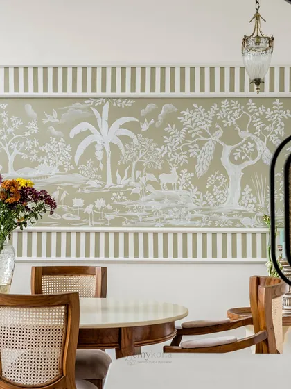 I believe in making every kona (corner) tell a story. This hand-painted Rajasthani mural in a dining area is a perfect example. It brings a serene, heritage-inspired narrative to everyday meals, blending traditional art with a modern aesthetic.