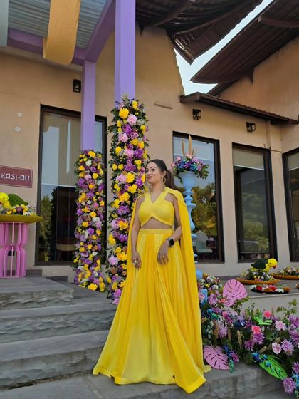 Feeling bright and ready for a carnival-themed after-party. My yellow outfit perfectly matched the sunny vibes of this outdoor Haldi celebration.