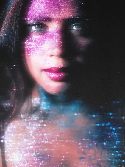 An artistic and abstract glitter portrait with a motion blur or prism effect. The result is a dreamy, cosmic image that feels otherworldly.
