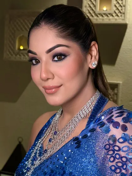 A portrait of the bride, her sleek high ponytail adding to her confident and glamorous look.