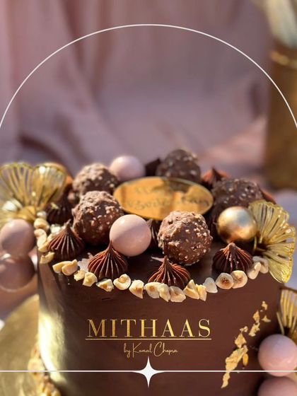 My Ferrero Rocher cake is more than a dessert, it's a memory in the making. This one is lavishly decorated with whole Ferrero Rocher chocolates, chocolate piping, and golden fan details.