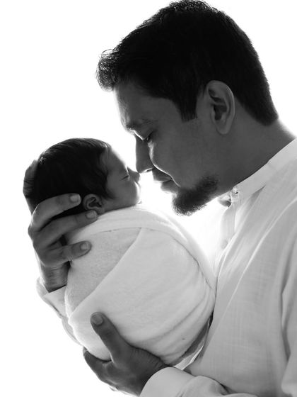 The quiet connection between a father and his newborn. I love capturing these gentle moments that show the strength and tenderness of a father's love.