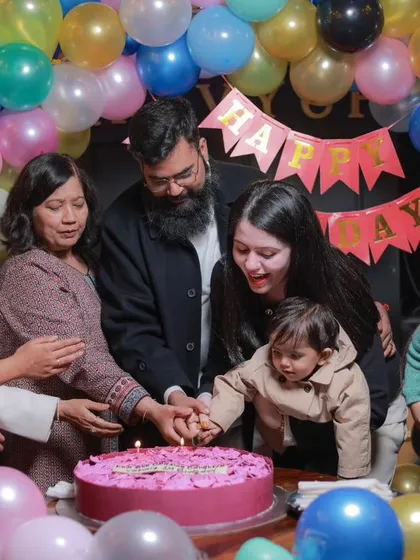The big cake-cutting moment is always full of love. I focus on capturing the entire family coming together to celebrate, creating a memory that includes grandparents, parents, and the birthday star.