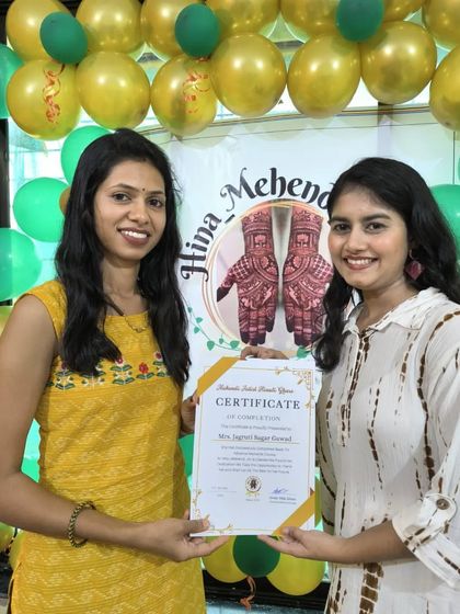 Presenting a certificate to a student who has completed her professional mehendi training. It is rewarding to see her hard work pay off.