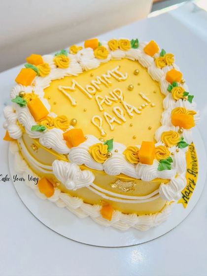 A heartfelt mango cake for "Mommy and Papa," perfect for their anniversary.