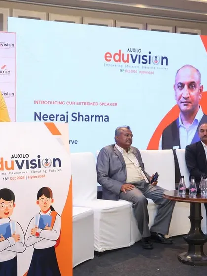 On stage with the panelists at the Eduvision conference, ready to start the discussion.