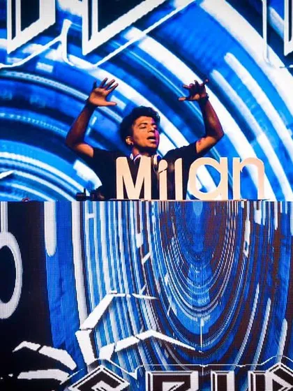 On the decks during the 'Milan' fest, surrounded by an immersive LED screen setup. I am experienced with large-scale stage productions and visuals that make a college pro-night feel like a major music festival.