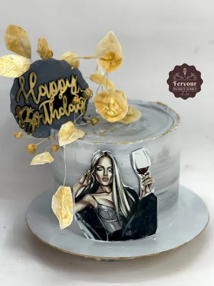 A chic and modern cake inspired by a Pinterest design. This chocolate truffle cake has a grey marble effect and is decorated with wafer paper leaves and a stylish illustration.
