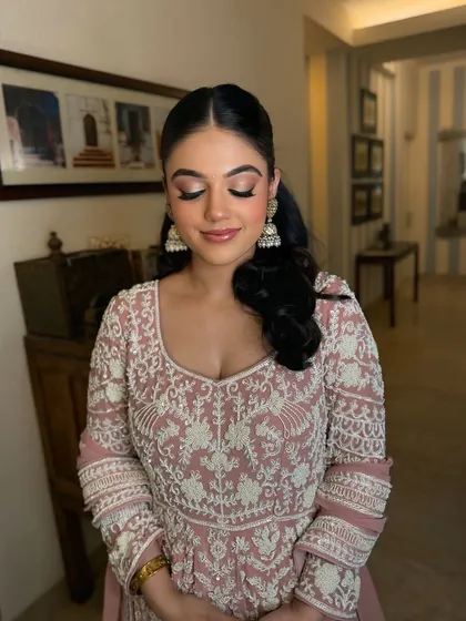 A close-up of the eye makeup for this soft party look. The shimmery lids and defined lashes make her eyes pop, while the skin remains natural and glowing.