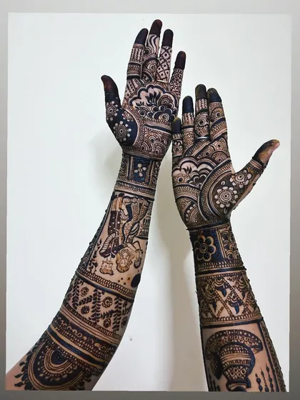 An example of my full-coverage bridal mehndi. This design extends up the arm with dense, traditional patterns, resulting in a breathtakingly dark and uniform stain.