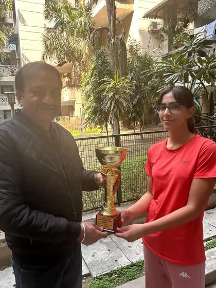 Another first title for Eshanya Khattar, this time winning the All India AITA CS U-14 singles tournament in Delhi. She is seen here receiving the large winner's cup.
