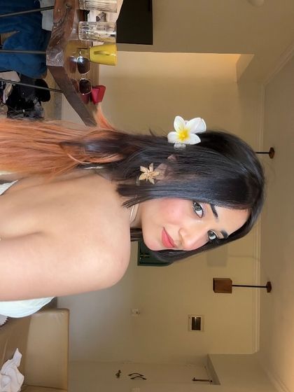 A soft and dreamy look with a flower in my hair. This close-up selfie shows a more delicate and romantic side of my style.