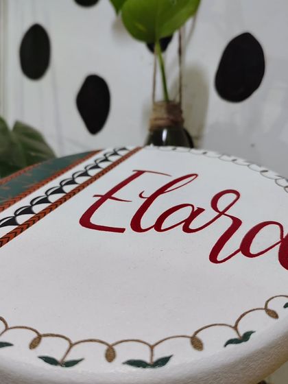 This traditional Indian art-inspired name board for "Elara" was a joy to create. We wove the family's roots into an earthy palette with a contemporary twist, creating a piece that traveled all the way to Germany.