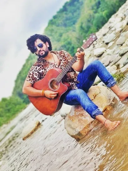 As an artist, I find inspiration everywhere, especially in nature. Whether it's a grand stage or a quiet riverbank, my guitar and I are always ready to create a musical experience that connects with the heart.