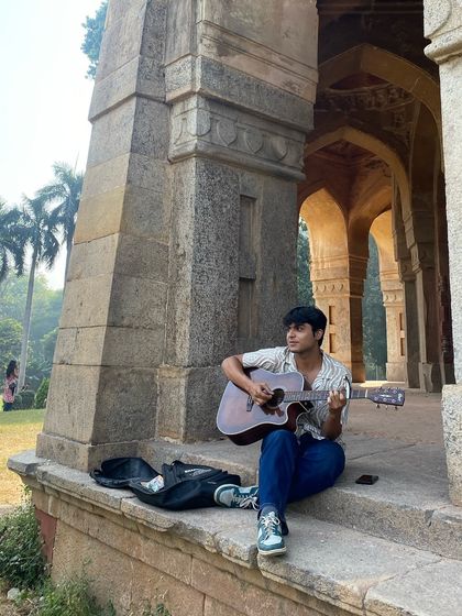 A musician finds his inspiration in the historic arches of a Delhi park during one of our creative projects. We encourage all forms of artistic expression.