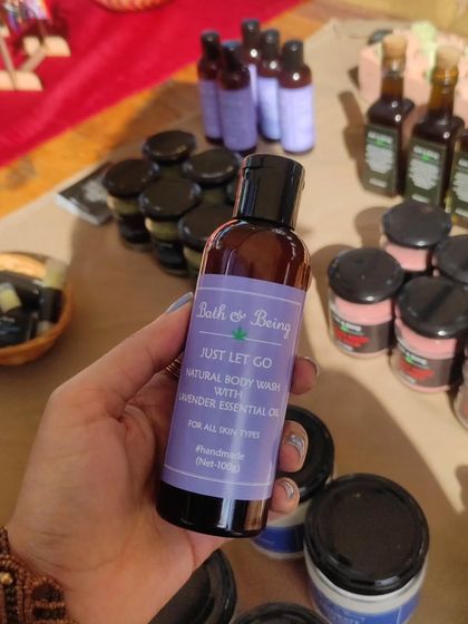 A snapshot from a fun Sunday at the Soul Kollektiv market, holding a bottle of our 'Just Let Go' lavender body wash.