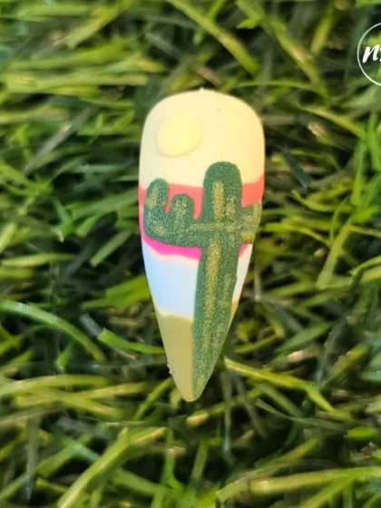 A textured cactus nail art design, perfect for a desert-themed manicure. We teach how to use different materials to create realistic textures like sand and stucco.