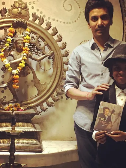 A picture of the young piano prodigy Lydian during his visit to my institute. He is seen here holding a photo of a past legend, connecting the new generation of artists with my rich history.