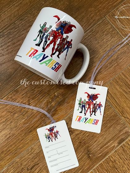 Themed return gifts perfect for a superhero fan's birthday party. This set includes a personalized mug and matching luggage tags featuring a colorful array of superheroes.