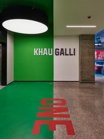 The entrance to the "Khau Galli" (Food Street) cafeteria. We used bold graphics and colors to create a distinct identity for this social space, making it a destination within the office.