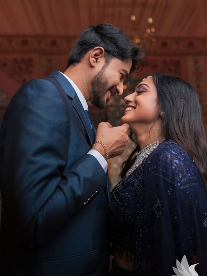 A romantic shot of my beautiful bride Dr. Akshara and her groom at their reception in Karur. Her glam look, with a smoky eye and diamond jewellery, is perfect for her navy blue sequined lehenga.