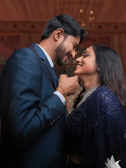 A romantic shot of my beautiful bride Dr. Akshara and her groom at their reception in Karur. Her glam look, with a smoky eye and diamond jewellery, is perfect for her navy blue sequined lehenga.