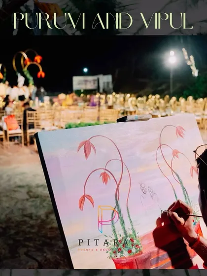 A unique touch: a live painter capturing the beauty of the decor on canvas during the event.