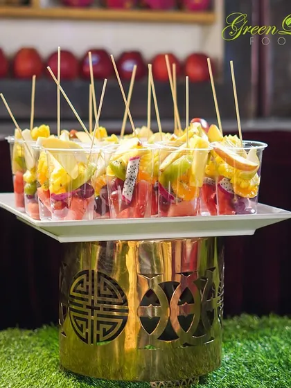 Freshness you can see. These fruit cups, served on an elegant golden stand, are a perfect example of how we present simple, healthy food in a sophisticated and appealing way.