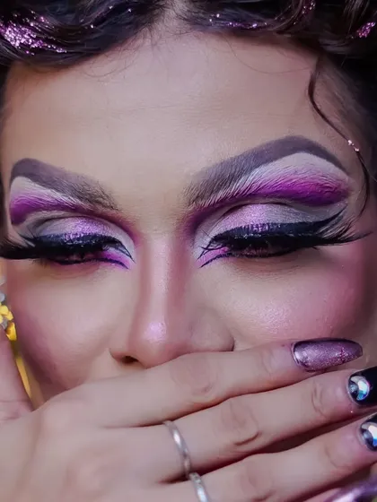 A close-up on the dramatic eye makeup, a hallmark of professional drag artistry.