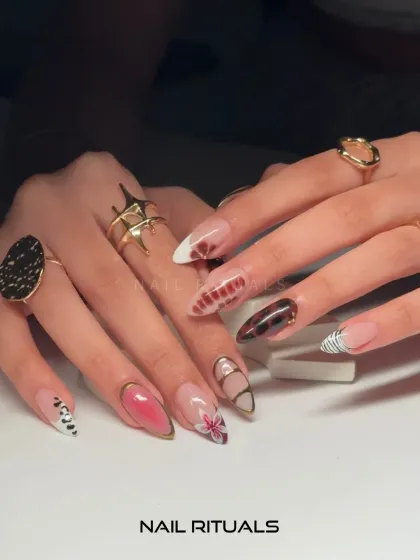 Each nail tells a different story. This set combines multiple designs, including animal print, floral art, and geometric patterns with gold chrome outlines for a truly unique look.