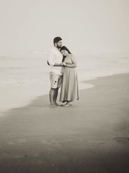 A quiet embrace by the sea. The monochrome treatment emphasizes the calm and peaceful mood of this moment.
