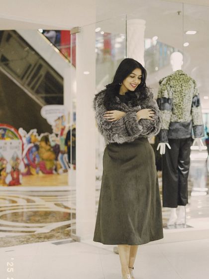 A cozy look with a grey faux fur jacket and a simple midi skirt. I love mixing textures to create an interesting winter outfit.