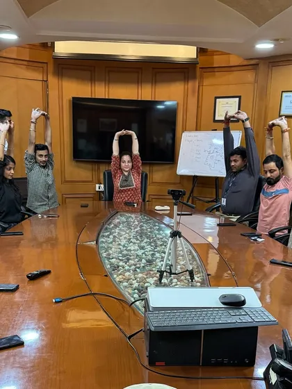 Leading a yoga session in the conference room at SMC Headquarters. It's amazing to see how a corporate space can be transformed into a place of wellness and mindfulness.