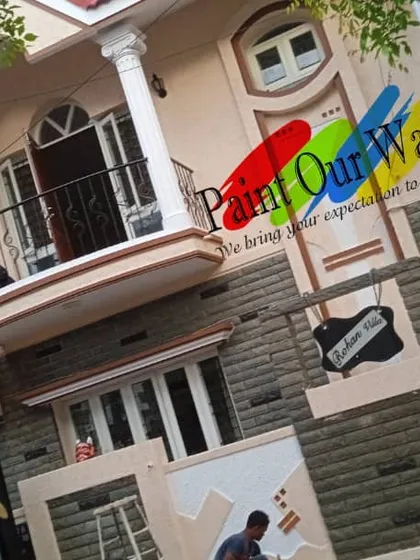 This image captures our team applying the final touches. We believe in a hands-on approach to guarantee customer satisfaction with every exterior house painting project we undertake.