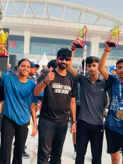 A group of my winners, holding their trophies high after a successful event. This is the result of their dedication and our collective hard work.